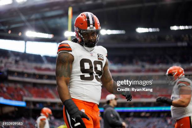Za'Darius Smith of the Cleveland Browns looks on during pregame warmups before an AFC wild-card playoff football game against the Houston Texans at...