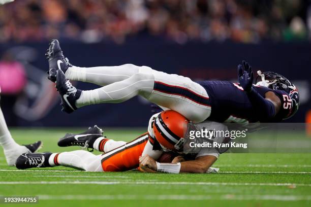 Desmond King II of the Houston Texans spins on top of Joe Flacco of the Cleveland Browns after a tackle during an AFC wild-card playoff football game...