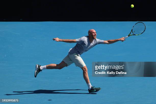 Adrian Mannarino of France plays a forehand in their round one singles match against Stan Wawrinka of Switzerland during the 2024 Australian Open at...