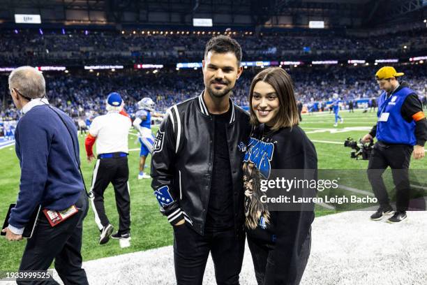 Taylor Lautner and Taylor Dome pose for a photo before the Detroit Lions wild-card matchup against the Los Angeles Rams at Ford Field on January 14,...