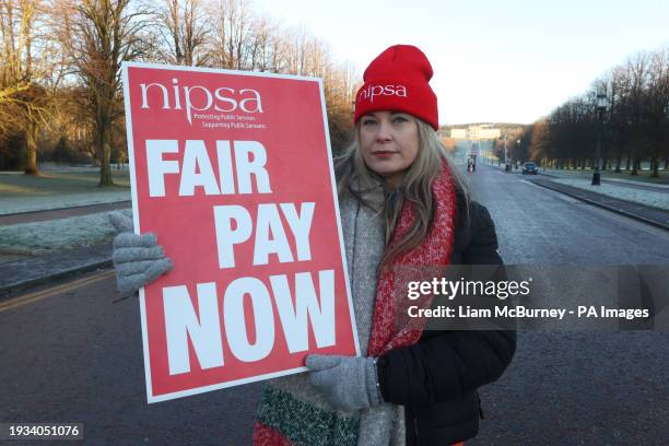 Civil service worker Janine White on the picket line outside the gates of the Stormont Estate, as an estimated 150,000 workers take part in walkouts...