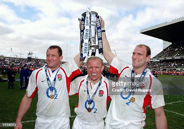 Richard Hill, Neil Back and Lawrence Dallaglio of England celebrate with the Six Nations Trophy after the RBS Six Nations Championship match between...