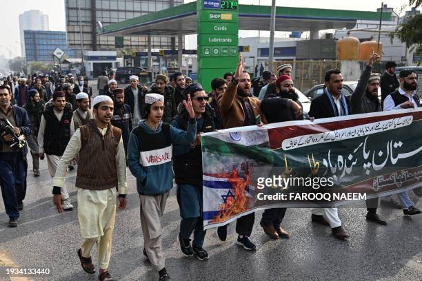 Youth activists of Muslim Talba Mahaz holding a banner shout slogans during a protest against Iranian air strike, in Islamabad on January 18, 2024....