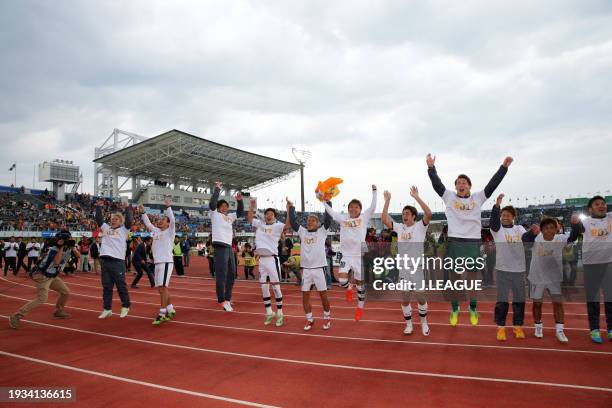 Shimizu S-Pulse players applaud fans as the team celebrates the promotion to the J1 following the 2-1 victory in the J.League J2 match between...