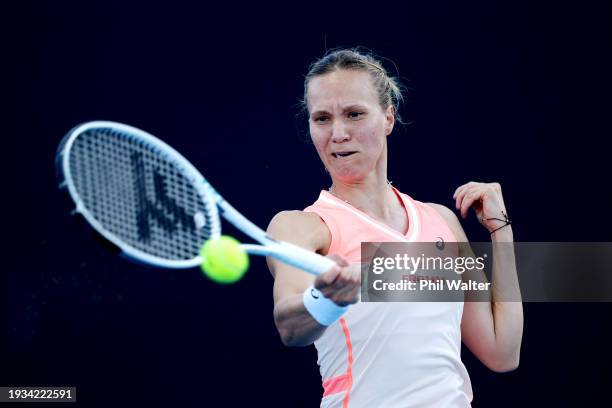 Viktorija Golubic of Switzerland plays a forehand in their round one singles match against Veronika Kudermetova during the 2024 Australian Open at...