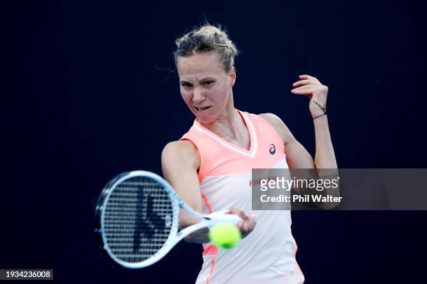 Viktorija Golubic of Switzerland plays a forehand in their round one singles match against Veronika Kudermetova during the 2024 Australian Open at...