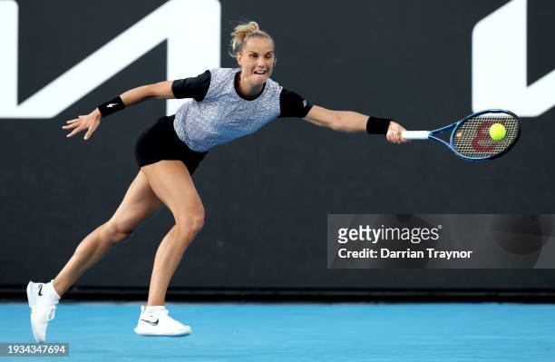 Arantxa Rus of Netherlands plays a forehand in their round one singles match against Anhelina Kalinina of Ukraine during the 2024 Australian Open at...