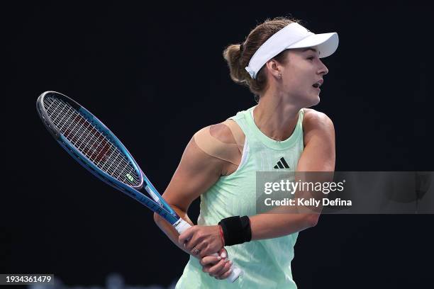 Anna Kalinskaya plays a backhand in their round one singles match against Katie Volynets of the United States during the 2024 Australian Open at...