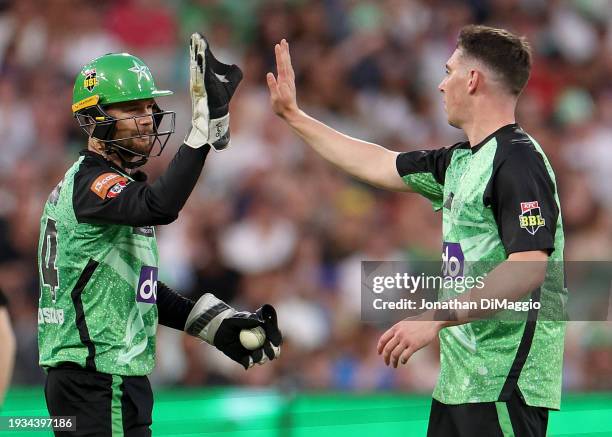 Peter Handscomb of the Stars and Dan Larwence of the Stars celebrate a wicket during the BBL match between Melbourne Stars and Hobart Hurricanes at...