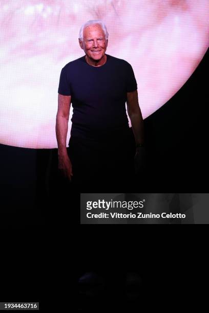 Fashion designer Giorgio Armani acknowledges the applause of the audience at the Giorgio Armani fashion show during the Milan Menswear Fall/Winter...