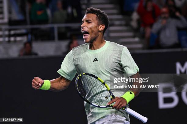 Canada's Felix Auger-Aliassime celebrates after victory against France's Hugo Grenier in their men's singles match on day five of the Australian Open...