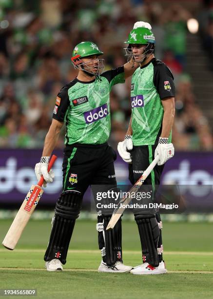 Marcus Stoinis of the Stars and Beau Webster of the Stars come together during the BBL match between Melbourne Stars and Hobart Hurricanes at...