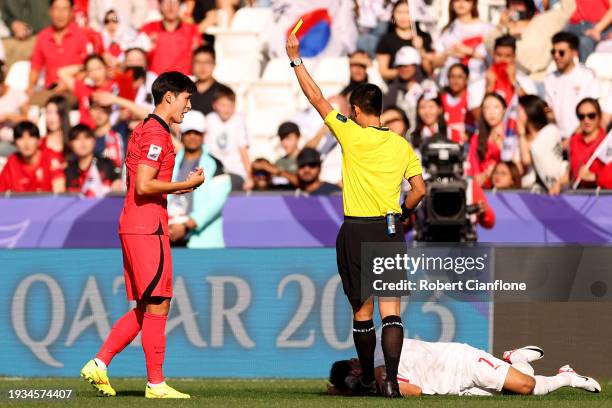 Park Yong-Woo of South Korea receives a yellow card for a foul on Ali Madan of Bahrain during the AFC Asian Cup Group E match between South Korea and...