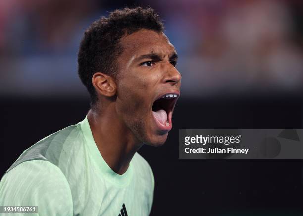 Felix Auger-Aliassime of Canada celebrates in their round one singles match against Dominic Thiem of Austria during the 2024 Australian Open at...