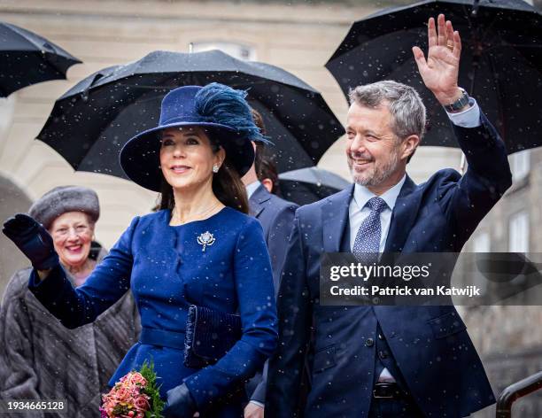 Queen Mary of Denmark and King Frederik X of Denmark wave as they arrive to participate in the Danish Parliament's celebration of the succession of...