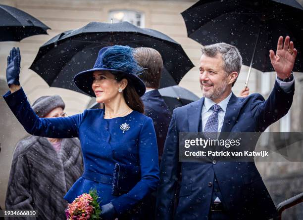 Queen Mary of Denmark and King Frederik X of Denmark wave as they attend the Danish Parliament's celebration of the succession of the throne at...