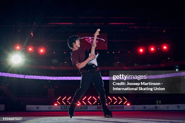Adam Siao Him Fa of France plays guitar on ice for a photograph during the ISU European Figure Skating Championships at Zalgirio Arena on January 14,...