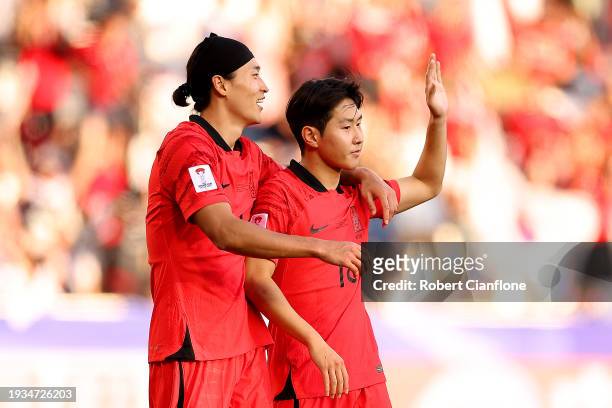Lee Kang-In of South Korea celebrates scoring their third goal with Cho Gue-Sung during the AFC Asian Cup Group E match between South Korea and...
