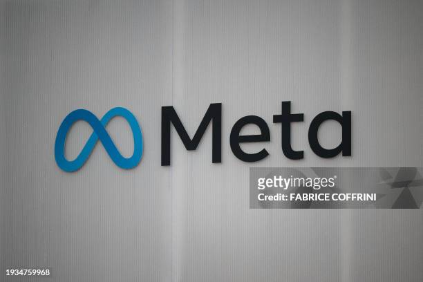 Photograph taken during the World Economic Forum annual meeting in Davos on January 18 shows the logo of Meta, the US company that owns and operates...