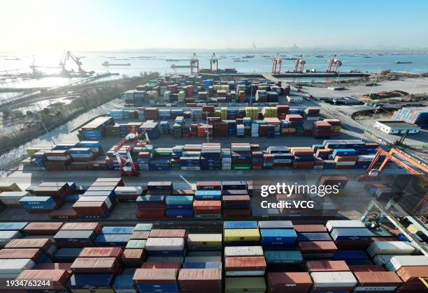 Aerial view of cargo ships loaded with containers at the container terminal of Yangzhou Port on January 15, 2024 in Yangzhou, Jiangsu Province of...