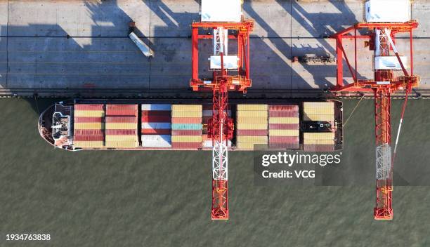 Aerial view of cargo ships loaded with containers at the container terminal of Yangzhou Port on January 15, 2024 in Yangzhou, Jiangsu Province of...