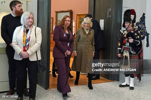 Britain's Queen Camilla reacts during a visit to Aberdeen Art Gallery, where she opened the gallery's 'Safe Space' as part of an initiative to...