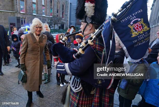 Britain's Queen Camilla reacts as she arrives to visit to Aberdeen Art Gallery, where she opened the gallery's 'Safe Space' as part of an initiative...