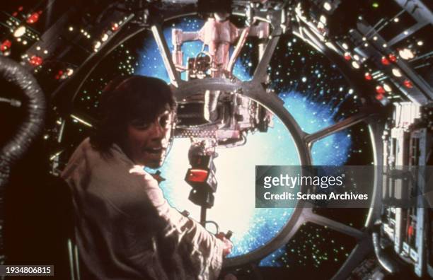 Mark Hamill as Luke Skywalker firing weapon in space battle in a scene from George Lucas 1977 classic 'Star Wars: Episode IV - A New Hope'.