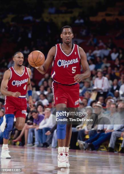 Danny Manning, Power Forward for the Los Angeles Clippers in motion dribbling the basketball down court during the NBA Midwest Division basketball...