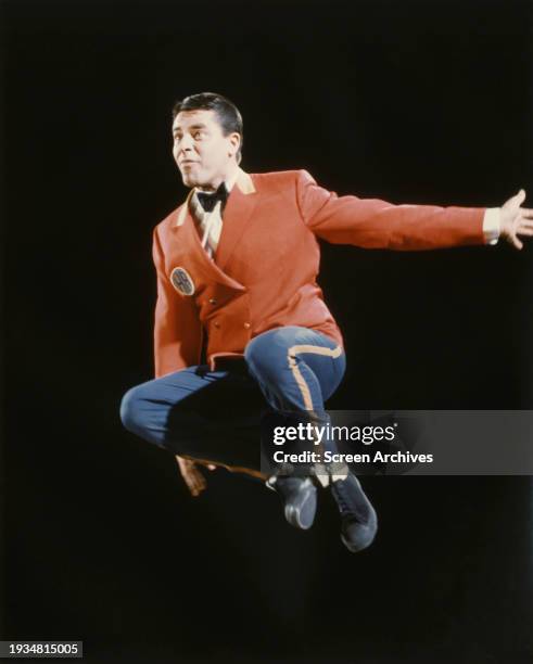 Jerry Lewis leaps in the air in a publicity portrait as 'The Bellboy' 1960.