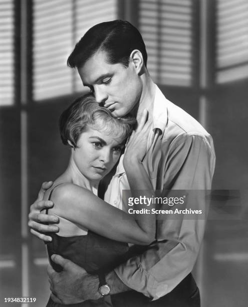 Janet Leigh in bra top embraces John Gavin from the 1960 Alfred Hitchcock thriller 'Psycho'.