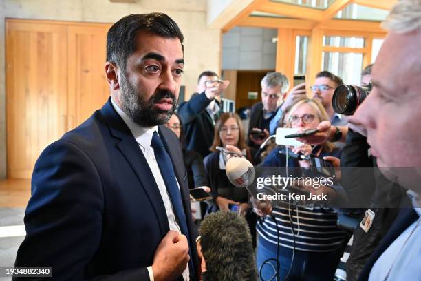 First Minister Humza Yousaf faces media questions in the lobby of the Scottish Parliament following First Minister's Questions, on January 18, 2024...