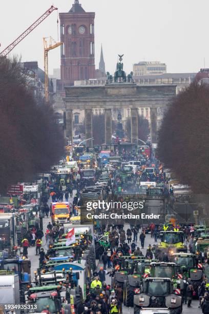 Protesting farmers depart with their tractors after attending a large-scale demonstration in front of the Brandenburg Gate on January 15, 2024 in...