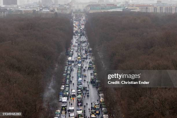 Protesting farmers depart with their tractors after attending a large-scale demonstration in front of the Brandenburg Gate on January 15, 2024 in...