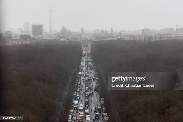 Protesting farmers depart with their tractors after attending a large-scale demonstration in front of the Brandenburg Gate on January 15, 2024 in...