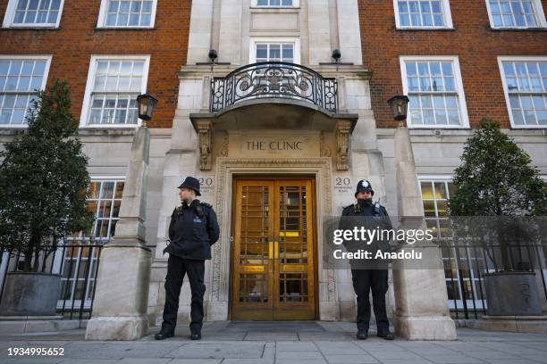 Police officers stand guard outside the London Clinic after the UK's Princess of Wales, Kate Middleton underwent planned surgery in London, United...