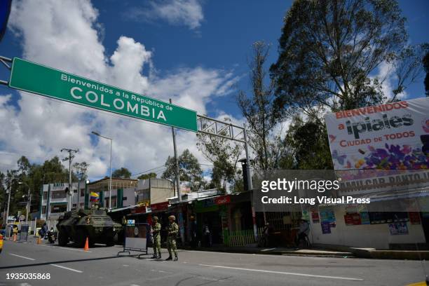 Colombia's national army heavily guards the border Rumichaca bridge with Ecuador amid Ecuador's internal armed conflict as narco violence spreads...