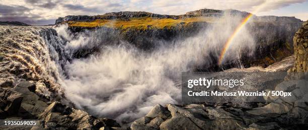 scenic view of waterfall against sky,dettifoss,iceland - dettifoss waterfall stock pictures, royalty-free photos & images