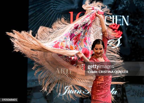 Spanish dancer Rosa Belmonte performs flapping a Manila shawl by Juan Foronda during the International Flamenco Fashion Week - SIMOF in Seville on...