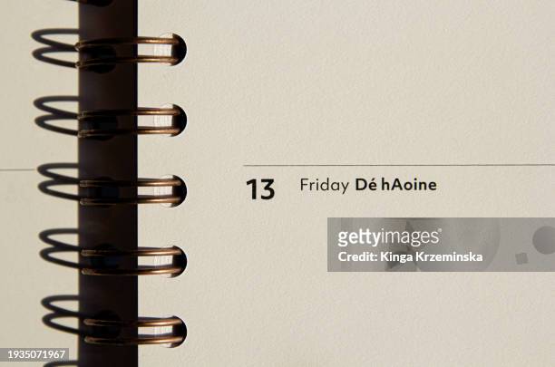 friday the 13th irish language - stationery close up stock pictures, royalty-free photos & images