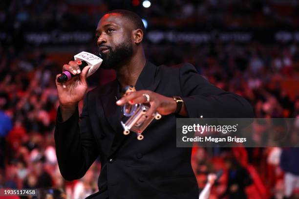 Former Miami Heat player Dwayne Wade addresses the crowd during a Hall of Fame induction ceremony during halftime of a game between the Charlotte...