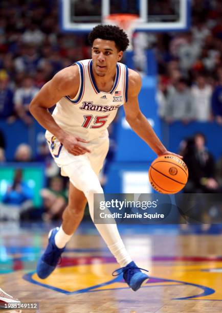 Kevin McCullar Jr. #15 of the Kansas Jayhawks controls the ball during the 1st half of the game against the Oklahoma Sooners at Allen Fieldhouse on...