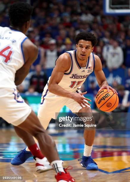 Kevin McCullar Jr. #15 of the Kansas Jayhawks controls the ball during the 1st half of the game against the Oklahoma Soonersat Allen Fieldhouse on...