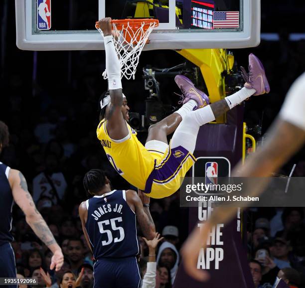 Los Angeles, CA Mavericks forward Derrick Jones Jr., #55, left, watches Lakers forward Jarred Vanderbilt, #2, dunk the ball in the second half at...