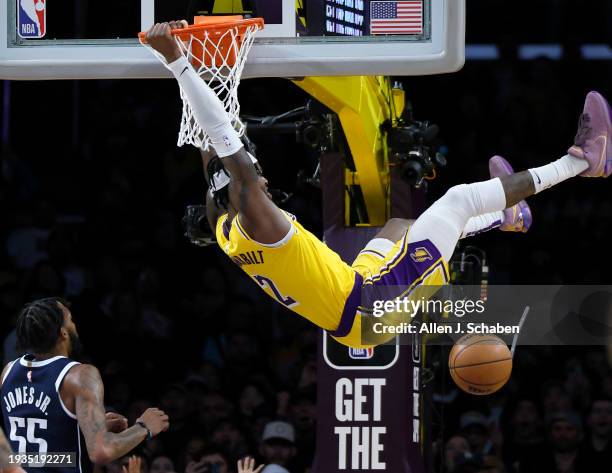 Los Angeles, CA Mavericks forward Derrick Jones Jr., #55, left, watches Lakers forward Jarred Vanderbilt, #2, dunk the ball in the second half at...