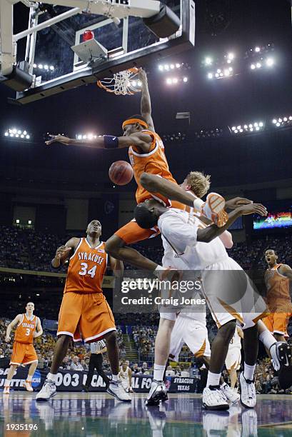 Hakim Warrick of the Syracuse University Orangeman dunks over Royal Ivey of the University of Texas at Austin Longhorns during the semifinal round of...