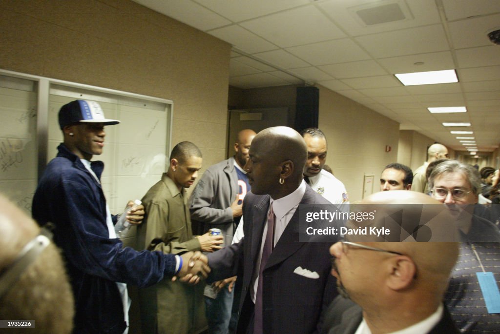 LeBron James shakes hands with Michael Jordan