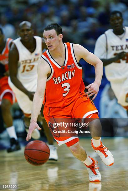 Gerry McNamara of the Syracuse University Orangeman drives during the semifinal round of the NCAA Final Four Tournament against the University of...