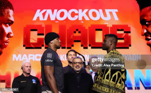 Anthony Joshua and Francis Ngannou face off during the Anthony Joshua v Francis Ngannou Press Conference at Outernet London on January 15, 2024 in...