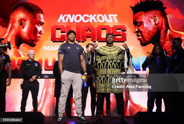 Anthony Joshua and Francis Ngannou pose during the Anthony Joshua v Francis Ngannou Press Conference at Outernet London on January 15, 2024 in...